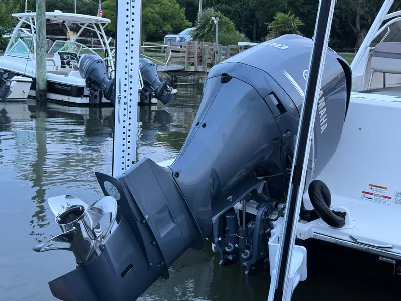 Slide: The Image of 2020 Cutwater C-24 DC boat detail, featuring fuel cap and chrome railing in storage. - 36