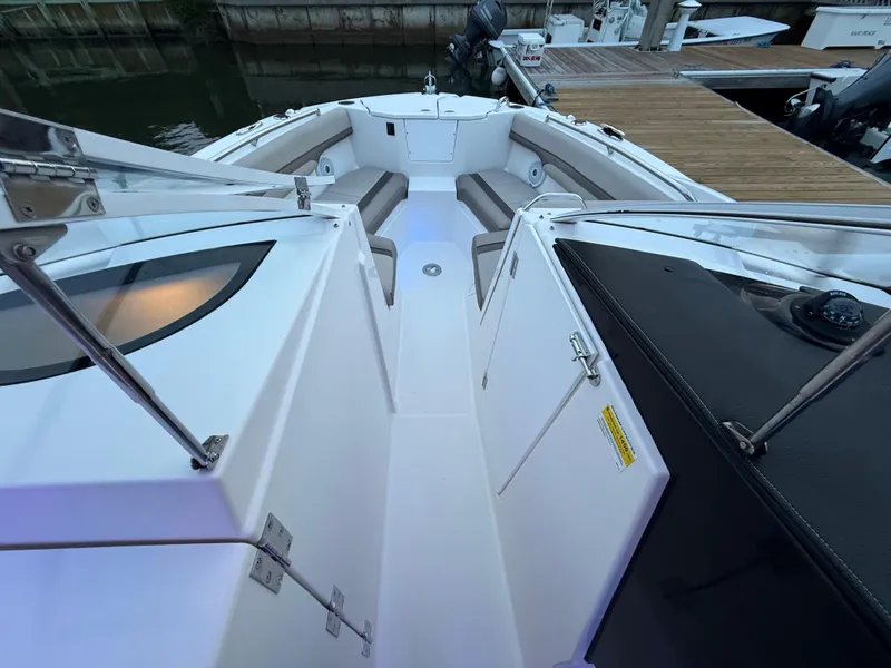 Slide: The Image of Close-up of a 2020 Cutwater C-24 DC boat propeller in a garage setting. - 38