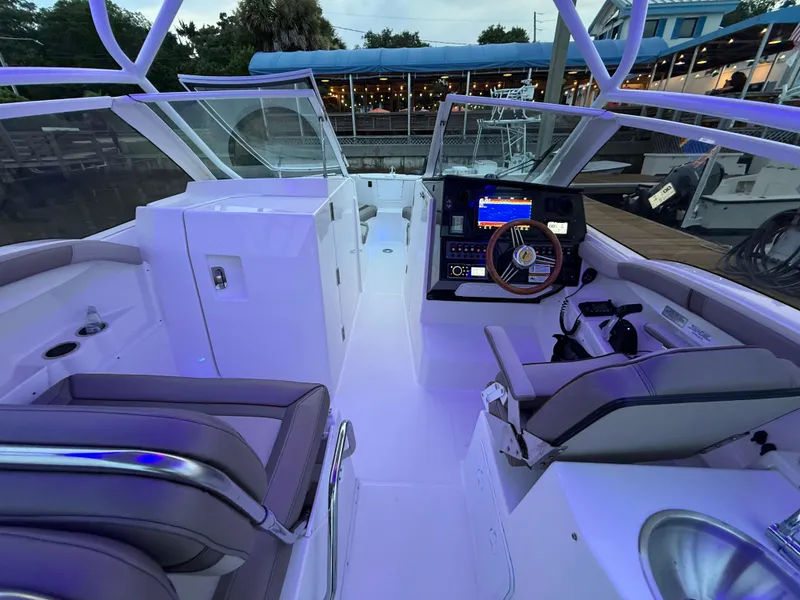 Slide: The Image of 2020 Cutwater C-24 DC boat stern view in a storage facility. - 40