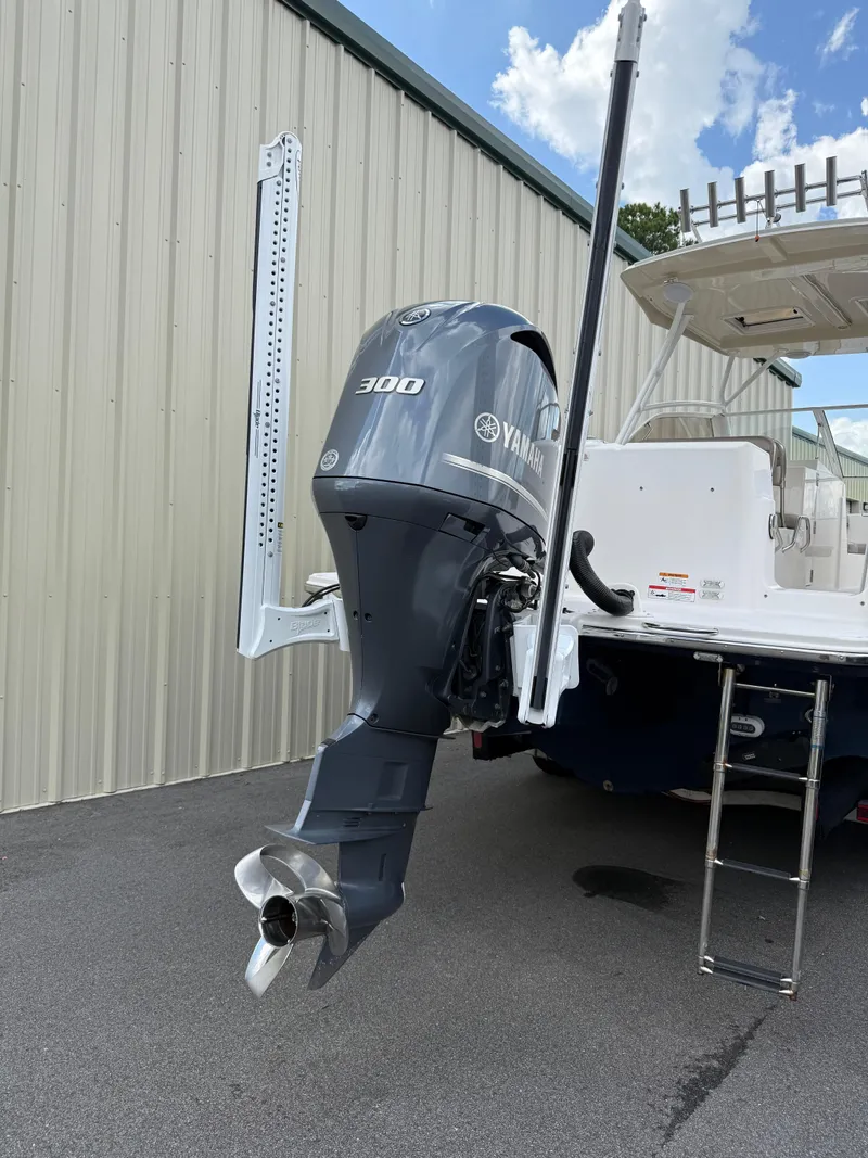 Slide: The Image of 2020 Cutwater C-24 DC boat stored in a metal garage, covered and secured. - 48