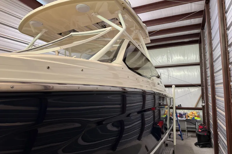 Slide: The Image of 2020 Cutwater C-24 DC boat with 300 horsepower engine in storage facility. - 5