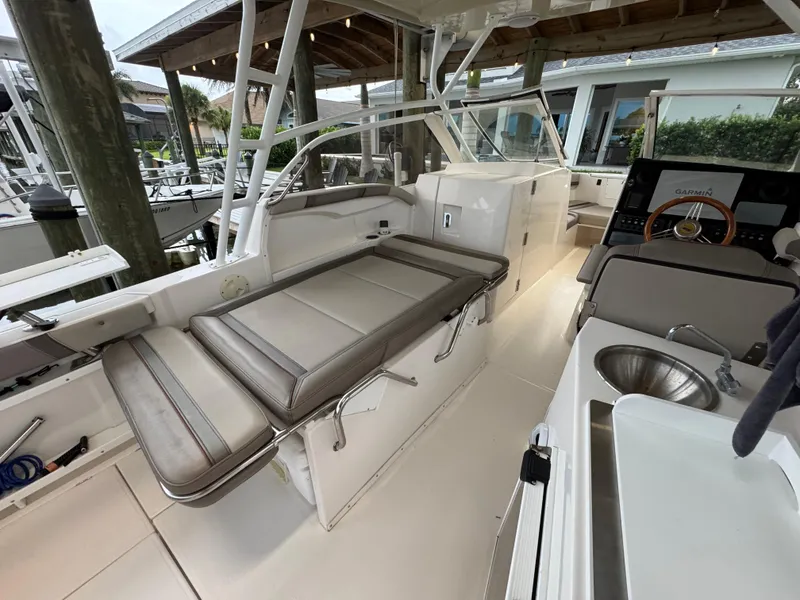 Slide: The Image of 2020 Cutwater C-24 DC boat on trailer, parked outside storage facility. - 50