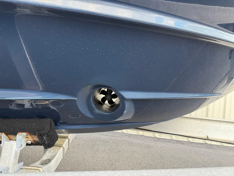 Slide: The Image of 2020 Cutwater C-24 DC boat on trailer, parked near storage facility. - 51