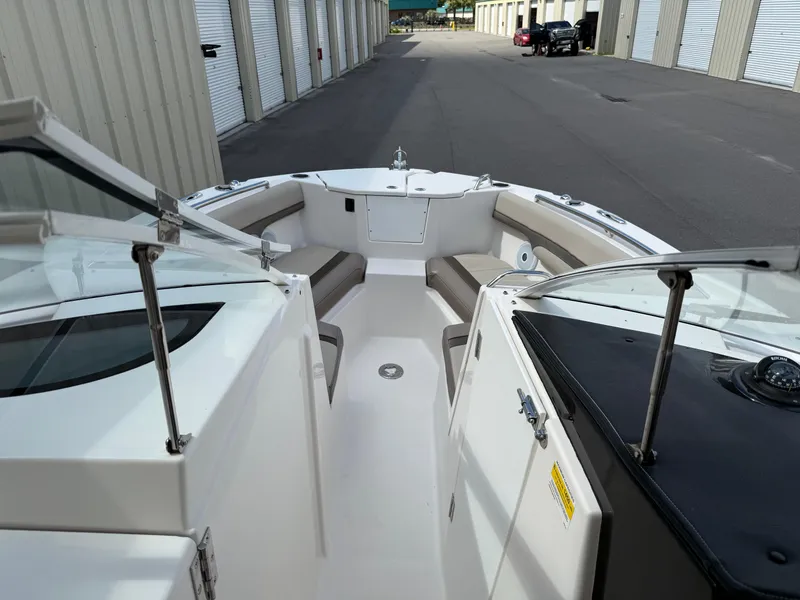 Slide: The Image of 2020 Cutwater C-24 DC boat on trailer, blue hull, parked outdoors. - 52