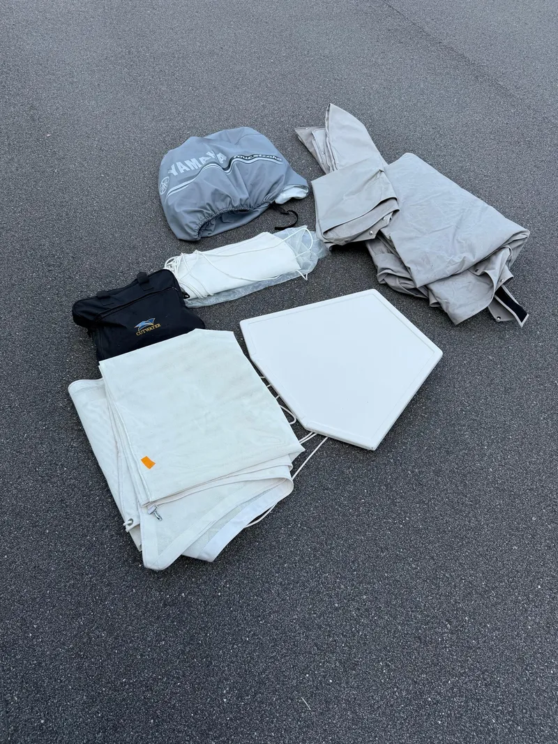 Slide: The Image of 2020 Cutwater C-24 DC boat on trailer, parked near storage units. - 54