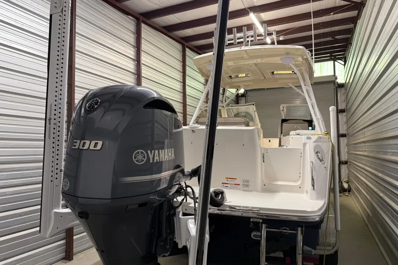 Slide: The Image of Close-up of a 2020 Cutwater C-24 DC boat propeller in a garage setting. - 6