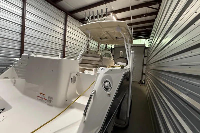 Slide: The Image of 2020 Cutwater C-24 DC boat interior bathroom with sink and toilet. - 7