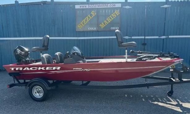 The Image of 2024 Tracker Pro 170 boat on trailer, red color, displayed at Sizzle Marine, Ohio. - 0