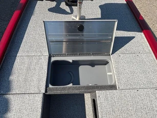Slide: The Image of 2024 Tracker Pro 170 boat storage compartment with open lid, showcasing interior space. - 10