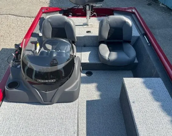 Slide: The Image of 2024 Tracker Pro 170 boat interior with dual seats and steering console. - 14