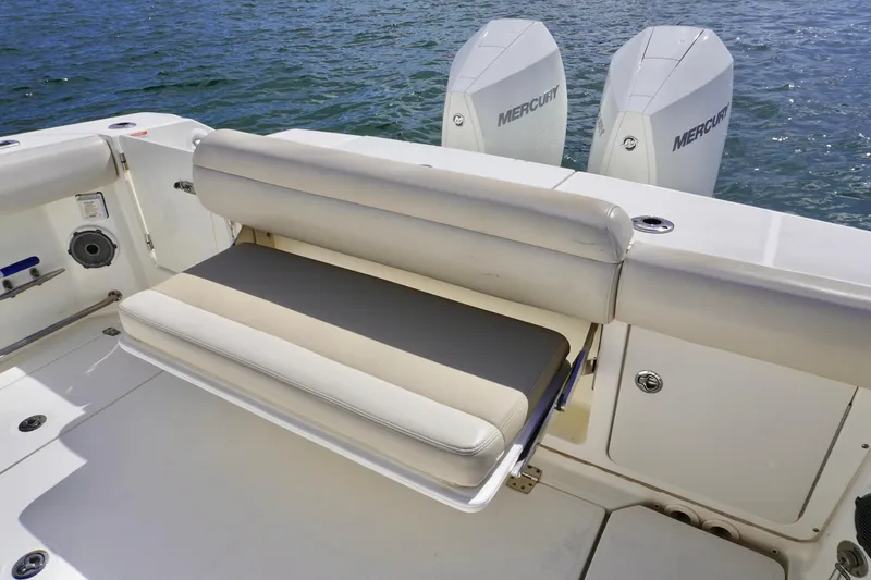 Slide: The Image of 2021 Boston Whaler 330 Outrage boat with foldable seating and dual Mercury engines. - 15