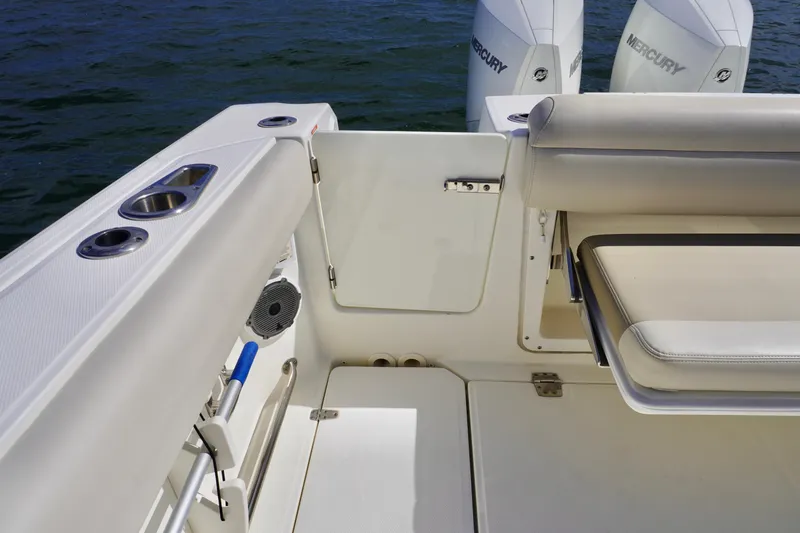 Slide: The Image of 2021 Boston Whaler 330 Outrage boat interior with seating and Mercury engines. - 20