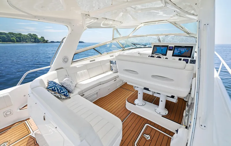 Slide: The Image of Luxurious 2015 Intrepid 430 Sport Yacht interior with plush seating and advanced navigation systems. - 10