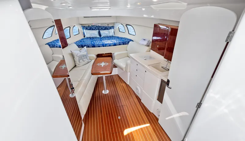 Slide: The Image of Luxurious interior of 2015 Intrepid 430 Sport Yacht with elegant seating and cozy bed. - 16