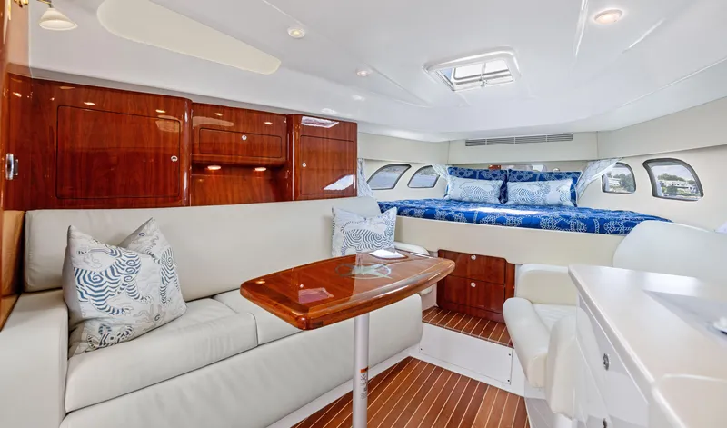 Slide: The Image of Luxurious interior of 2015 Intrepid 430 Sport Yacht with elegant seating and bedding. - 17