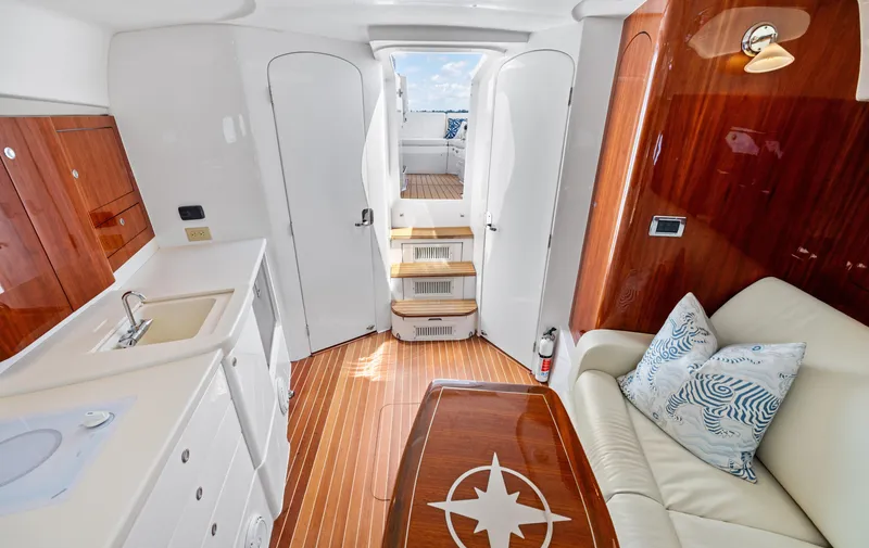 Slide: The Image of Luxurious interior of 2015 Intrepid 430 Sport Yacht with elegant wood finishes and plush seating. - 20