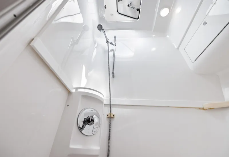 Slide: The Image of 2015 Intrepid 430 Sport Yacht shower area with sleek, modern design and chrome fixtures. - 22