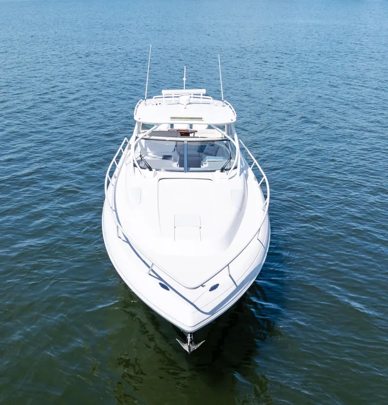 Slide: The Image of 2015 Intrepid 430 Sport Yacht on calm blue water, front view. - 3