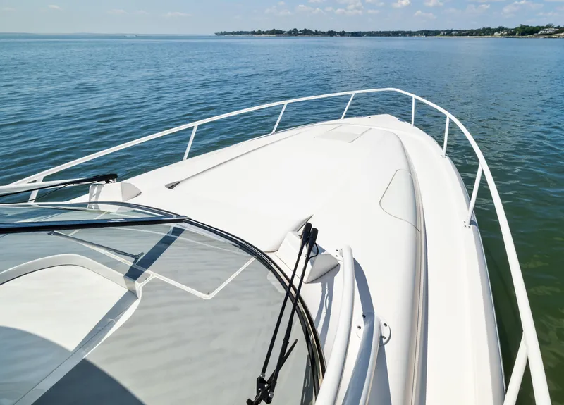 Slide: The Image of 2015 Intrepid 430 Sport Yacht cruising on calm waters under a clear sky. - 8