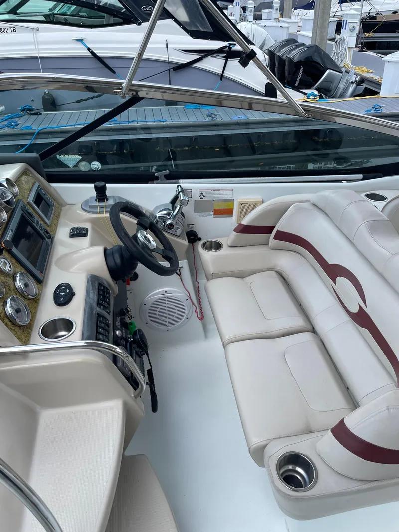 Slide: The Image of 2010 Formula 350ss boat interior with steering wheel and seating area. - 11