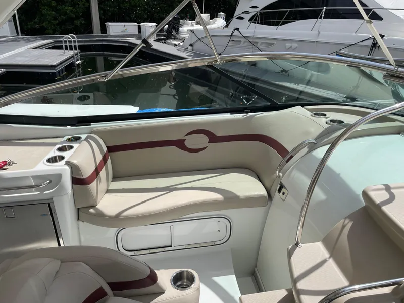 Slide: The Image of Interior of a 2010 Formula 350ss boat with beige seating and cup holders. - 13
