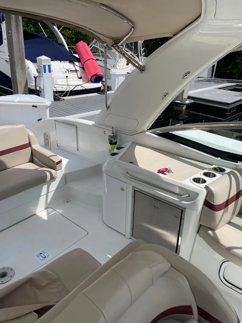 Slide: The Image of Interior of a 2010 Formula 350ss boat with seating and kitchenette. - 18