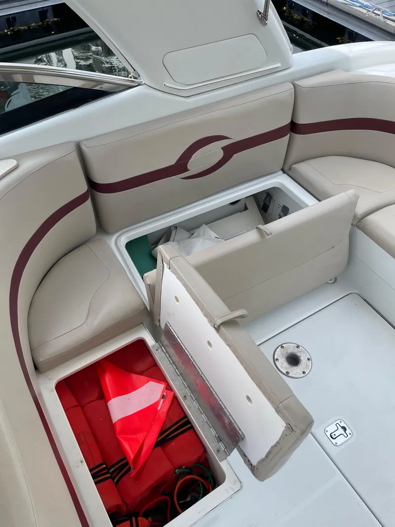 Slide: The Image of 2010 Formula 350ss boat interior with open storage compartments and seating. - 19
