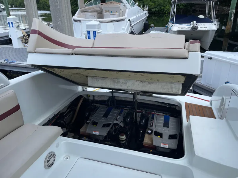 Slide: The Image of 2010 Formula 350ss boat engine compartment open at marina dock. - 23