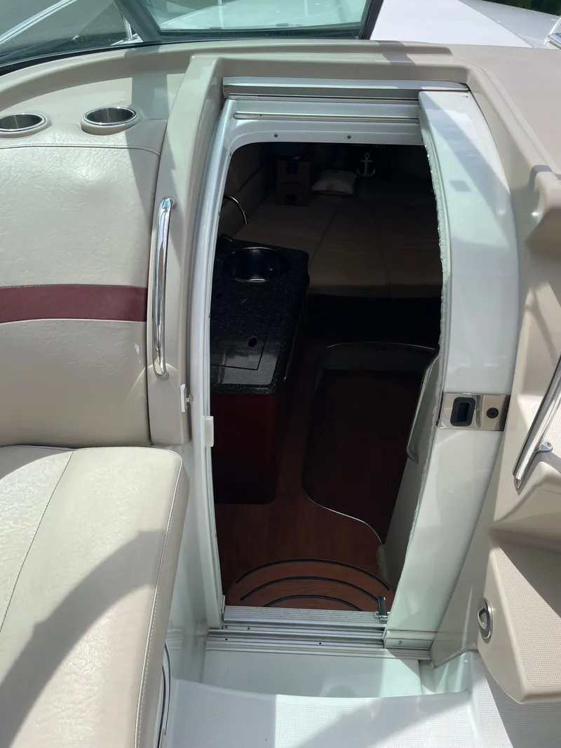 Slide: The Image of 2010 Formula 350ss boat interior with cabin entrance and seating area. - 28