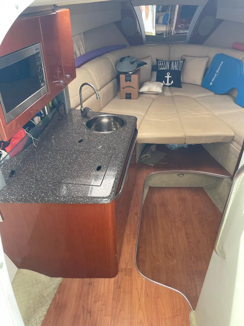 Slide: The Image of Interior of 2010 Formula 350ss boat with kitchenette and seating area. - 29