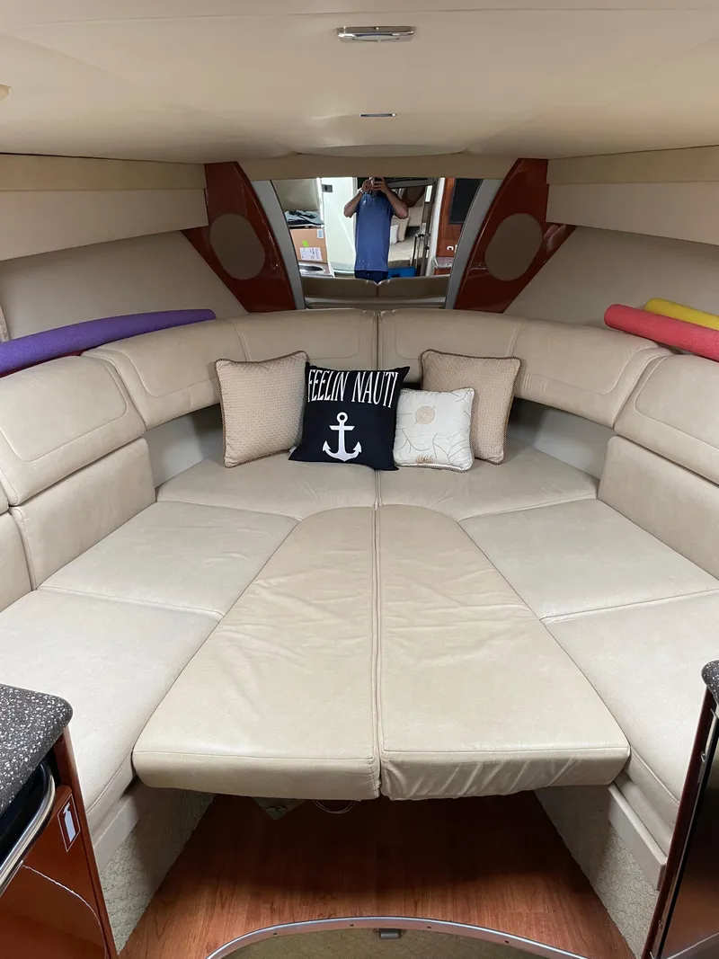 Slide: The Image of Luxurious interior of a 2010 Formula 350ss boat with beige seating and decorative pillows. - 32