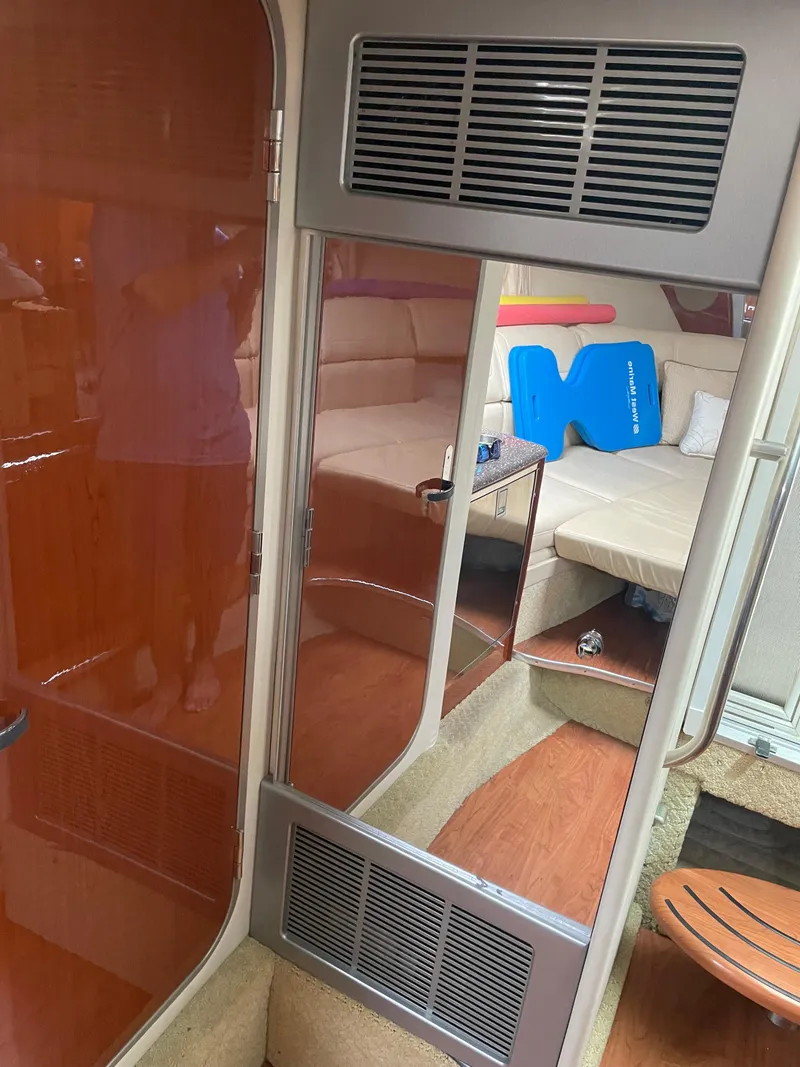 Slide: The Image of Interior of a 2010 Formula 350ss boat with seating and wooden finishes. - 36