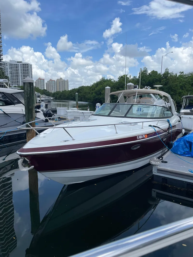 Slide: The Image of 2010 Formula 350ss boat docked at marina under blue sky. - 42