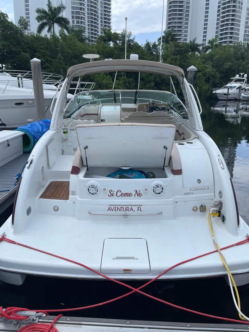 Slide: The Image of 2010 Formula 350ss boat docked in Aventura, FL marina with high-rise buildings. - 47