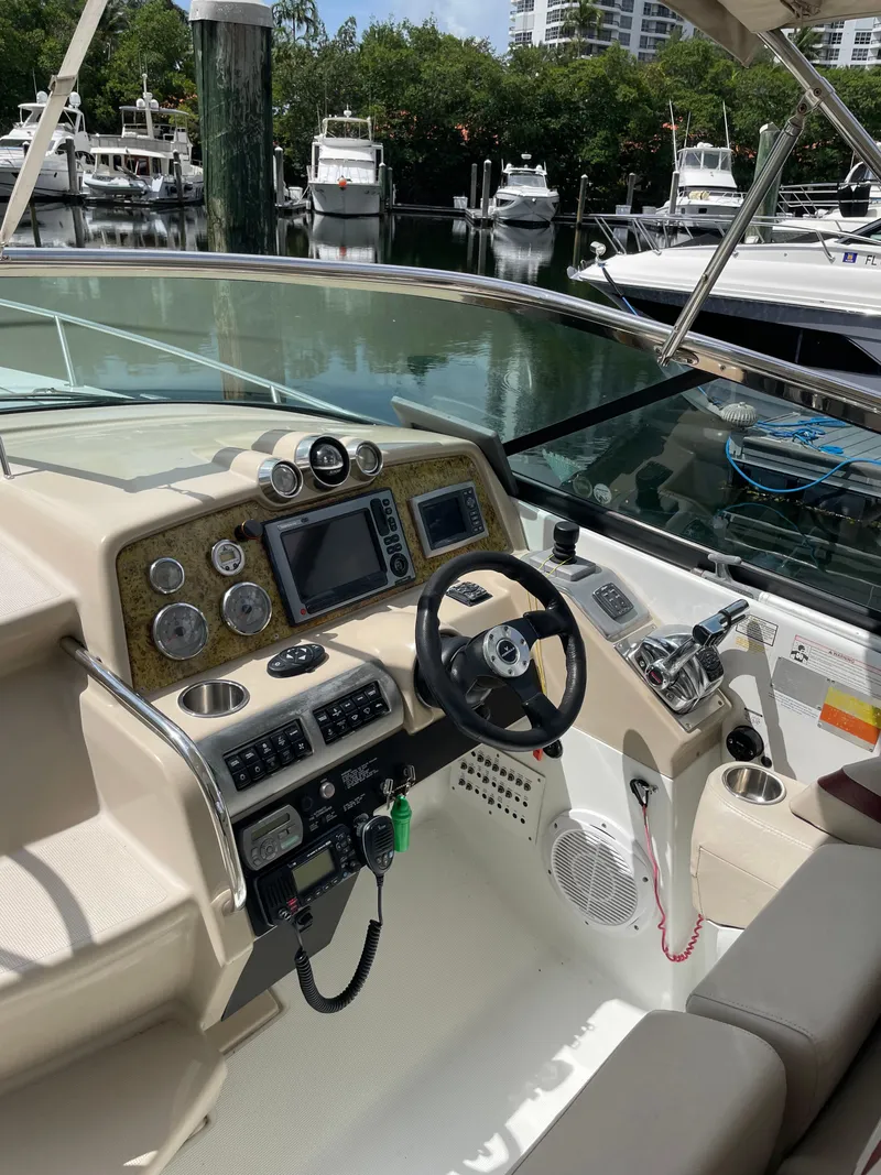 Slide: The Image of Cockpit of a 2010 Formula 350ss boat with modern navigation equipment and controls. - 6