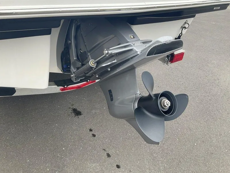 Slide: The Image of 2023 Chaparral 23 SSi boat propeller and stern drive on pavement. - 14