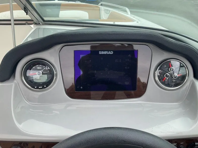 Slide: The Image of Dashboard of 2023 Chaparral 23 SSi boat with Simrad display and gauges. - 17