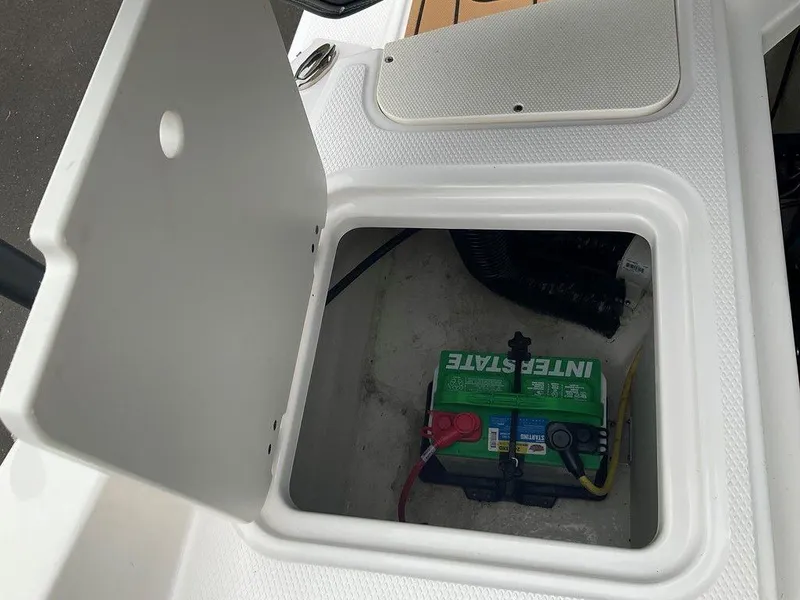 Slide: The Image of Battery compartment of 2023 Chaparral 23 SSi boat with Interstate battery. - 34