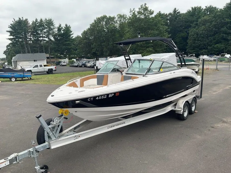 Slide: The Image of 2023 Chaparral 23 SSi boat on trailer in outdoor setting. - 6