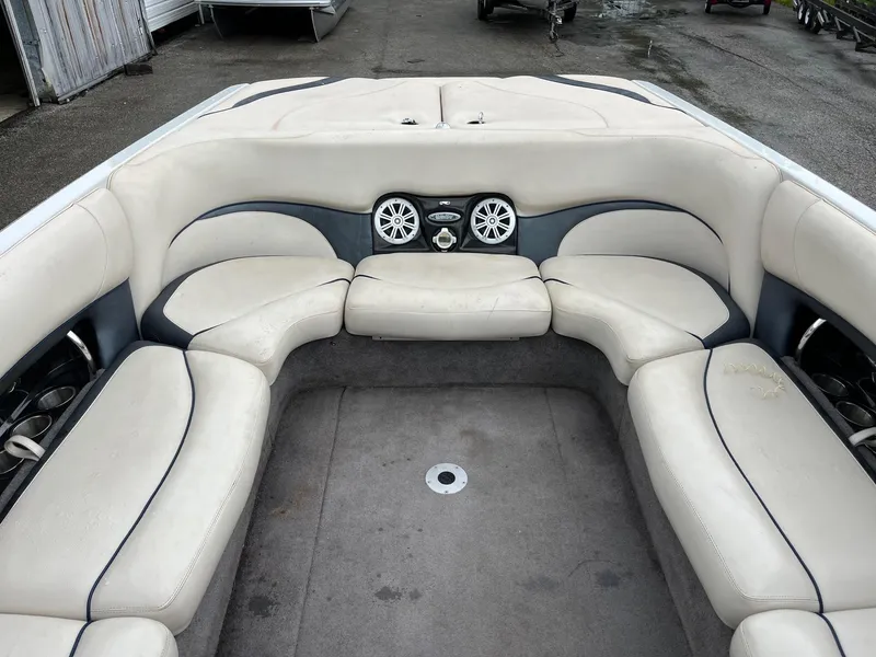 Slide: The Image of 2007 Malibu Wakesetter 247 LSV boat interior with white seating and built-in speakers. - 11