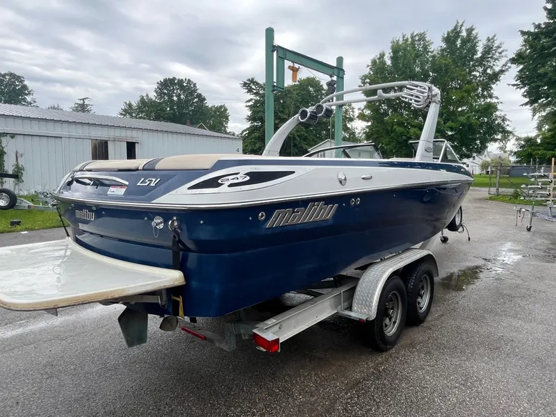 Slide: The Image of 2007 Malibu Wakesetter 247 LSV boat on trailer, parked outdoors. - 3