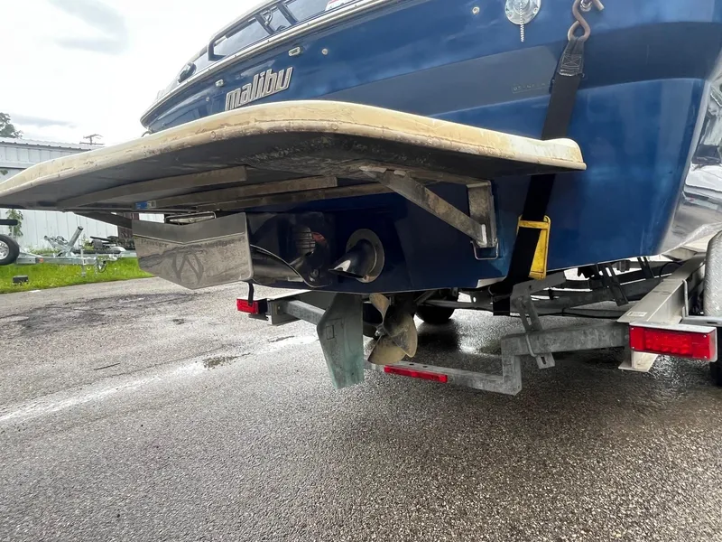 Slide: The Image of 2007 Malibu Wakesetter 247 LSV boat on trailer, rear view showing propeller and hull. - 4