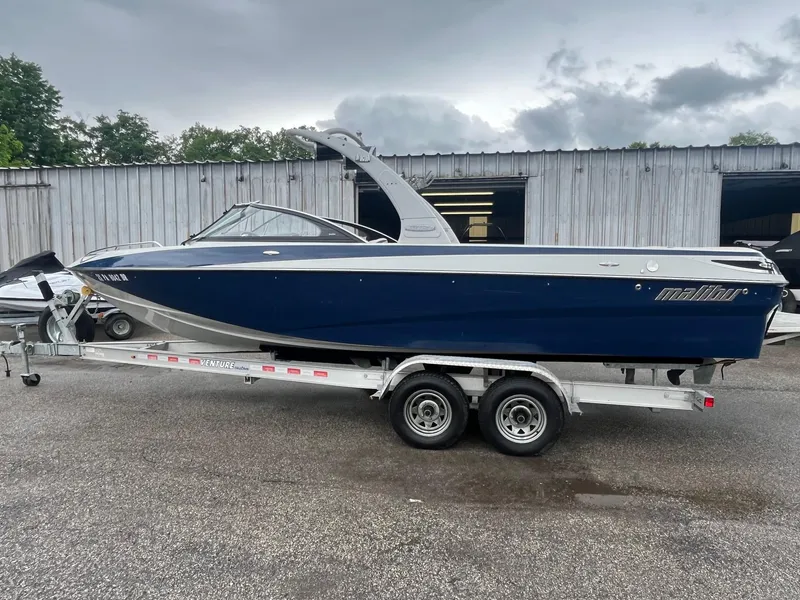 Slide: The Image of 2007 Malibu Wakesetter 247 LSV boat on trailer, parked outdoors. - 6