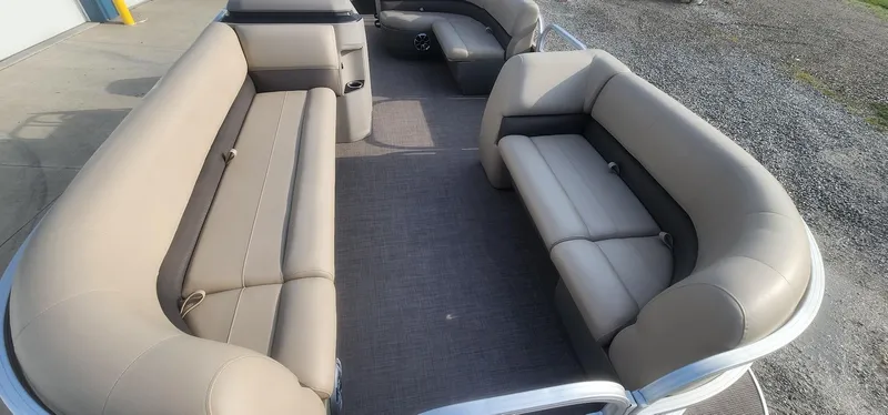 Slide: The Image of 2024 Sun Tracker Party Barge 18 DLX interior with spacious seating and modern design. - 6