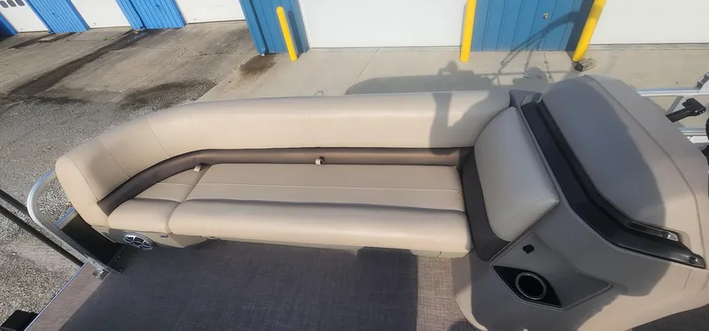 Slide: The Image of 2024 Sun Tracker Party Barge 18 DLX pontoon boat seating area with beige upholstery. - 7