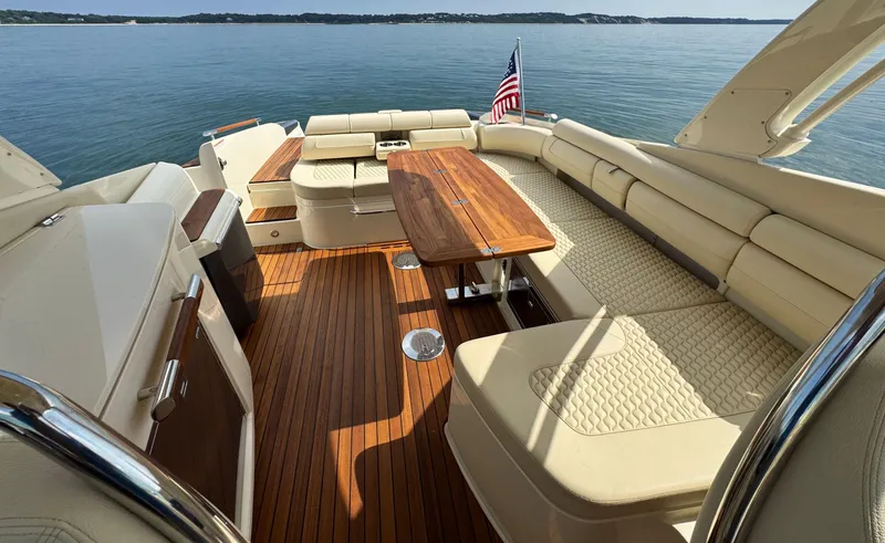 Slide: The Image of Luxurious 2022 Chris-Craft Launch 35 GT boat interior with elegant seating and wooden deck. - 12