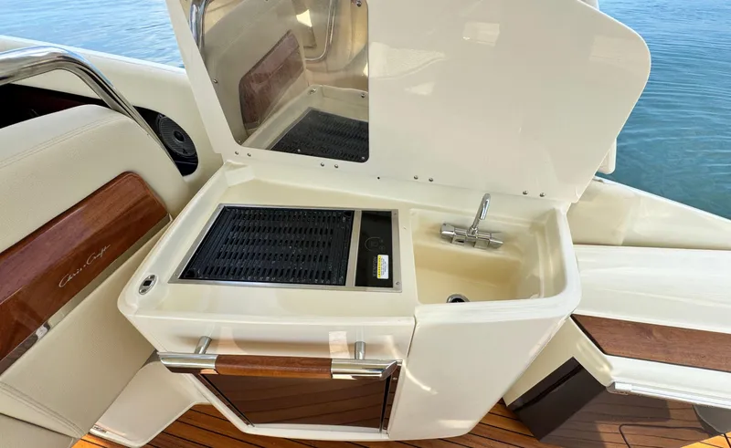 Slide: The Image of 2022 Chris-Craft Launch 35 GT I/O Heritage Edition boat with onboard sink and grill. - 19