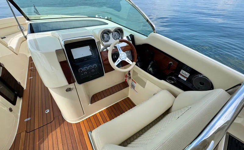 Slide: The Image of 2022 Chris-Craft Launch 35 GT I/O Heritage Edition boat interior with elegant dashboard and steering. - 20