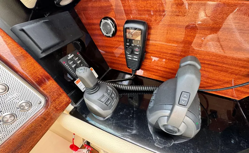 Slide: The Image of 2022 Chris-Craft Launch 35 GT I/O Heritage Edition dashboard with controls and radio equipment. - 22