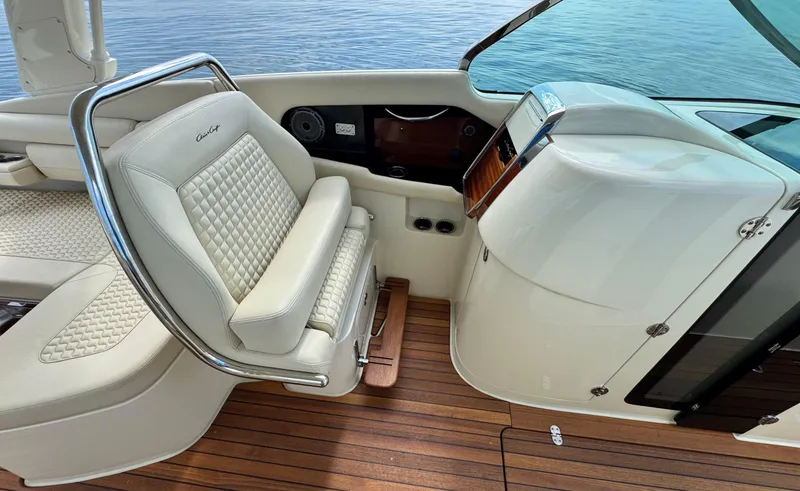 Slide: The Image of 2022 Chris-Craft Launch 35 GT I/O Heritage Edition interior with luxurious seating and wooden deck. - 28